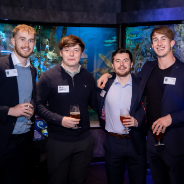 Four UCD alumni at a global event.